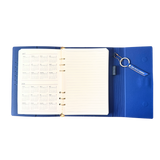 Calendar view of blue clutch journal folio and calendar with 'BAD BITCH ENERGY' text and colored pen.