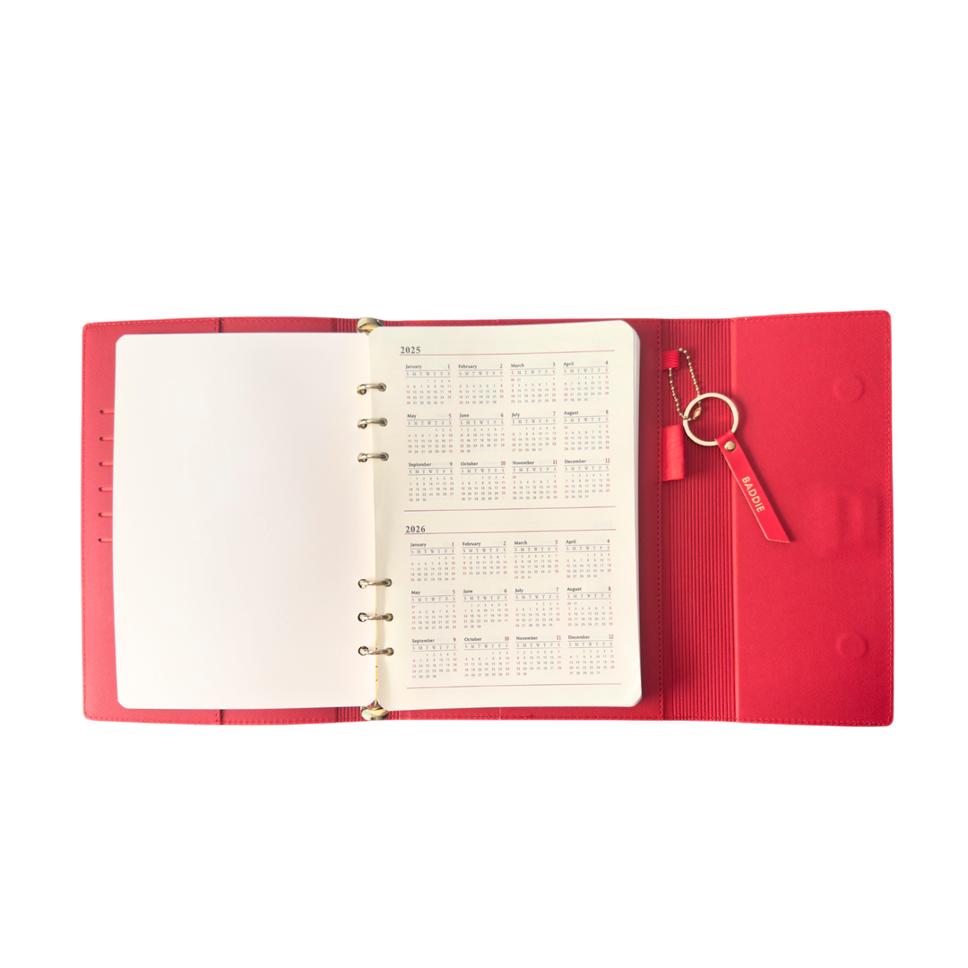 Red planner with open pages 