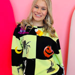 Green and black checkered Halloween sweatshirt with rhinestone and sequin Halloween  motif.