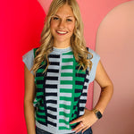 Blue colorblock ladder knit top with structured shoulders and navy, light blue, and green pattern.