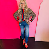 Toffee leopard print blouse with blue and red stripe accents and drop shoulder rib band trim.