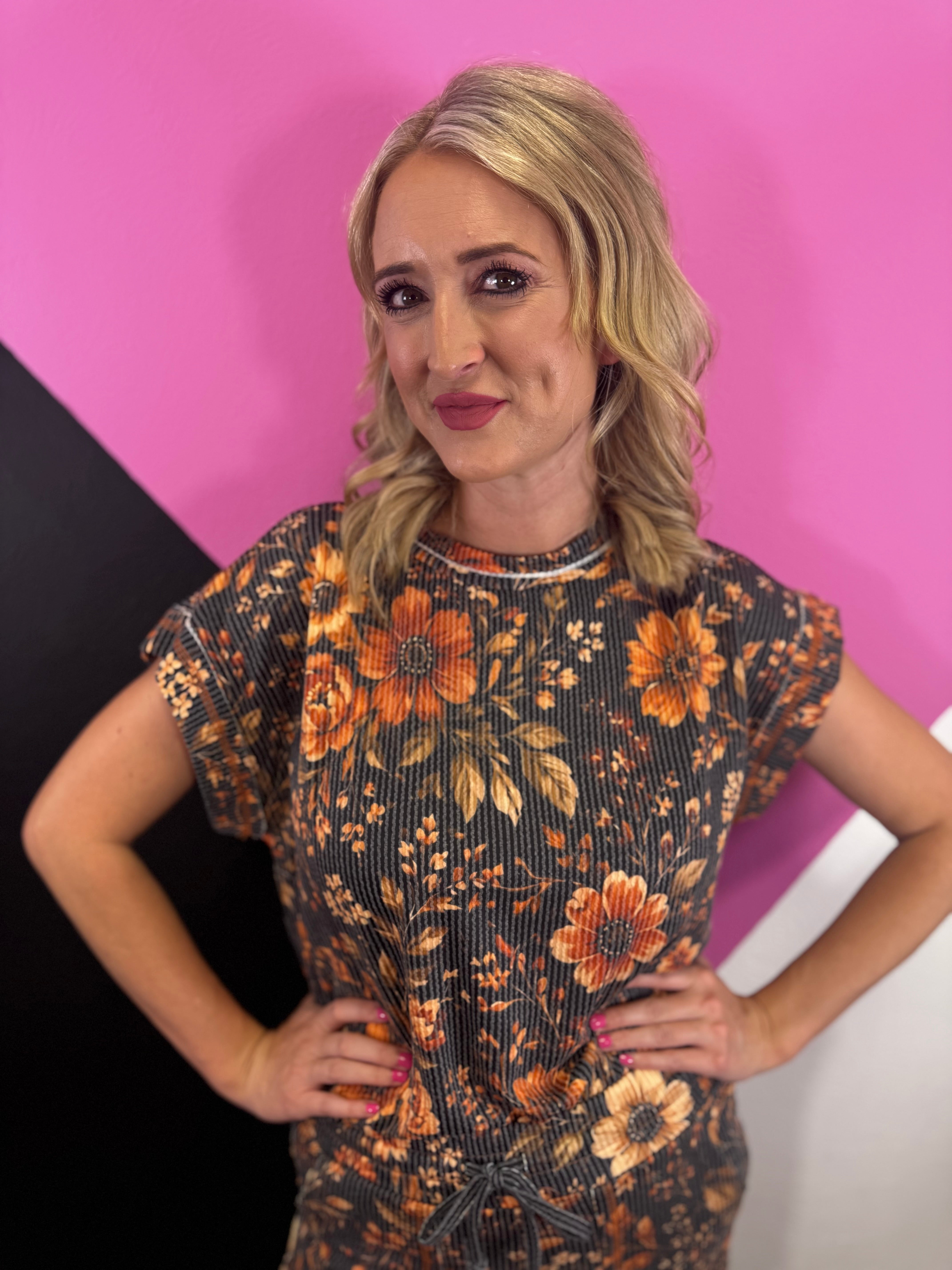 Brown floral short sleeve top with amber, rust, cream, and earthy blooms.