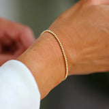 Bara Boheme Delicate 14K gold filled beaded bracelet with 2mm beads. 