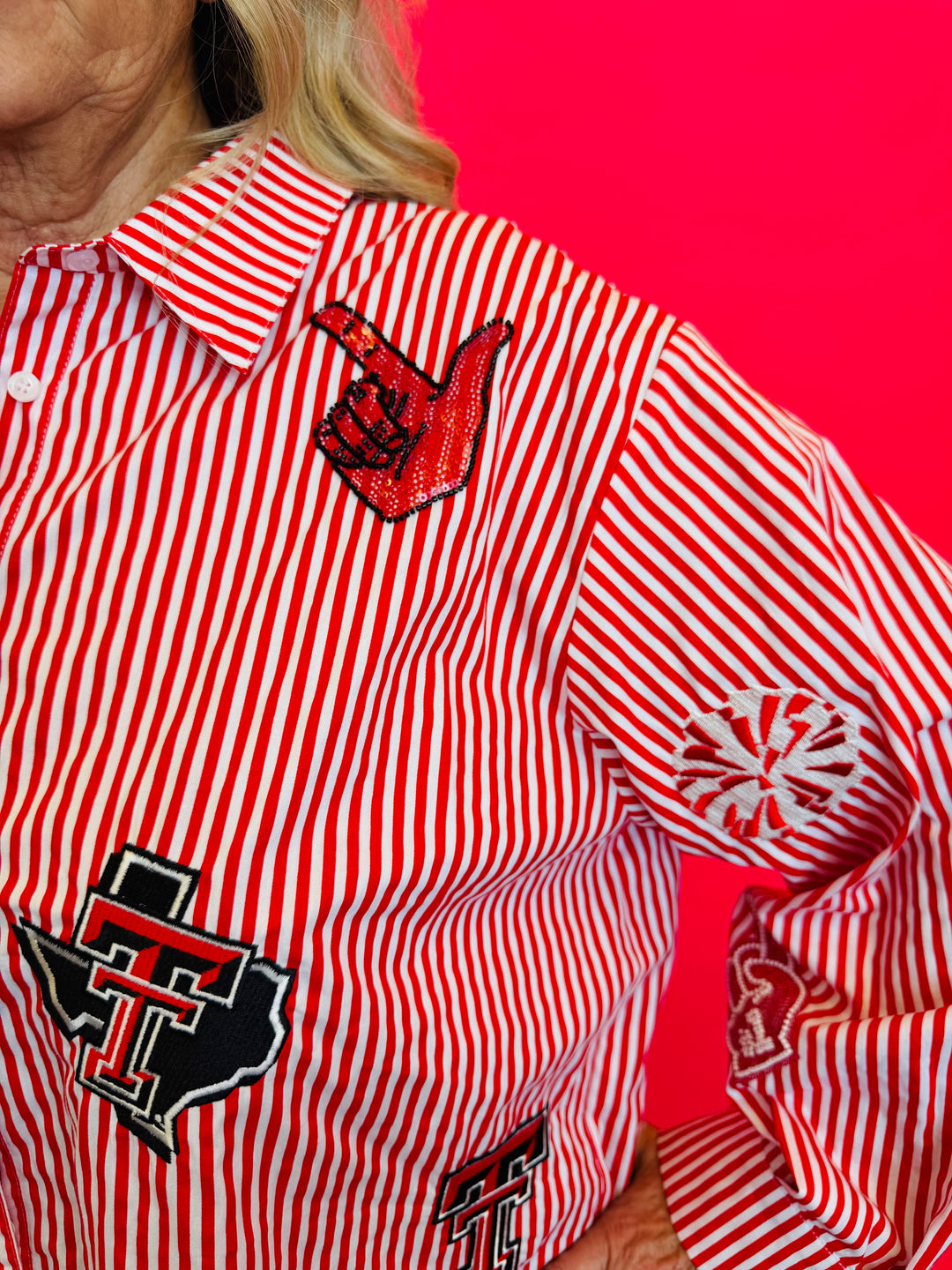 Close up of Queen Of Sparkles red and white striped icon Texas Tech game day blouse.