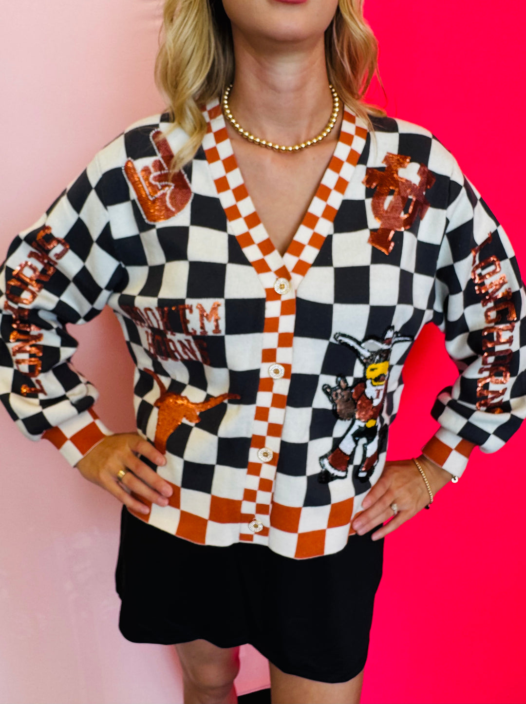 Close up of Queen Of Sparkles checkered University Of Texas  game day sequin cardigan.