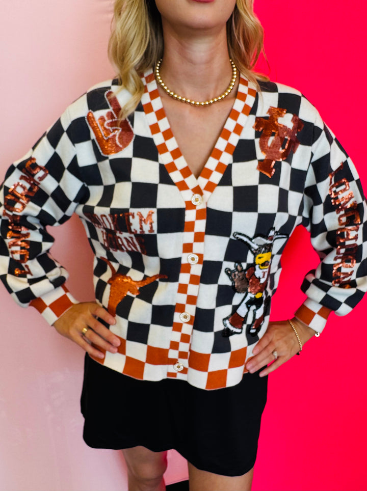 Close up of Queen Of Sparkles checkered University Of Texas  game day sequin cardigan.