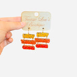 acrylic dangle earrings, happy thanksgiving, orange, red and mustard yellow letters. 