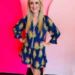 Blue floral dress with navy and white striped front trim and ruffle hemline