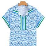 flat lay of blue and white geometric floral half zip top