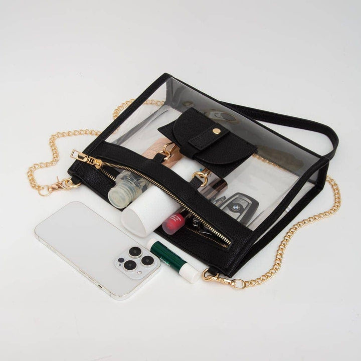 Clear crossbody bag with black trim and matching hardware, featuring a detachable sunglasses holder—elegant and event-ready.