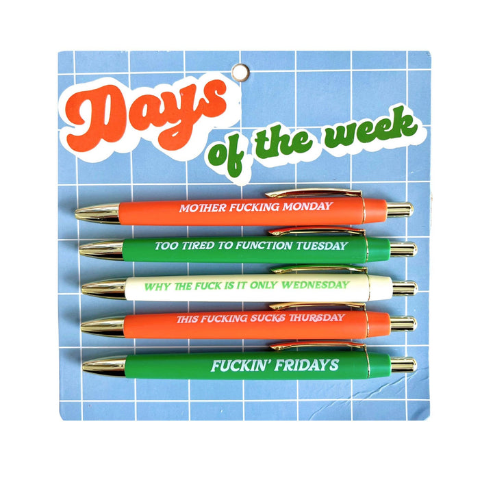 Set of pens with humorous phrases on a blue grid background
