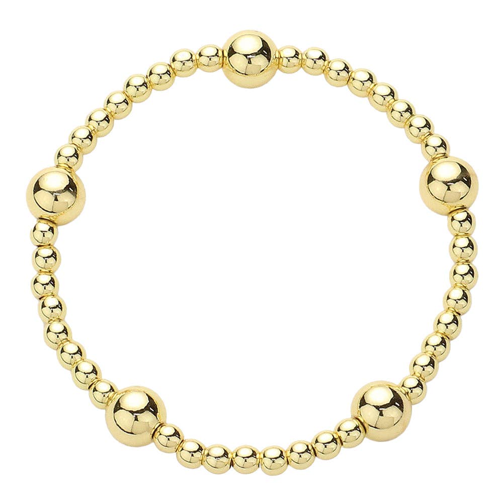 Waterproof stainless steel 4mm gold beaded bracelet with 8mm gold bead accent.