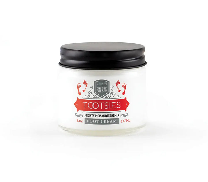 A 6oz glass jar of "Tootsies" therapeutic foot cream, with a small swatch of the cream.