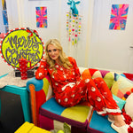 Red bow ruffle pajama set with long sleeves and pants, perfect for cozy holiday comfort.