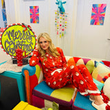 Red bow ruffle pajama set with long sleeves and pants, perfect for cozy holiday comfort.