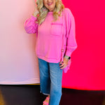 Full-body view of the Candy Pink Brushed Hi-Low Sweater styled with denim jeans, showing the relaxed fit and flattering hi-low hemline.