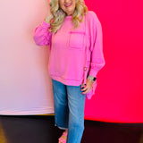 Full-body view of the Candy Pink Brushed Hi-Low Sweater styled with denim jeans, showing the relaxed fit and flattering hi-low hemline.