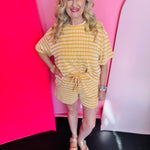 Mustard striped ribbed lounge set with relaxed top and elastic-waist shorts for everyday comfort.