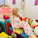 Pink and aqua nutcracker pajama set with ruffle trim and festive peppermint details.