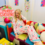 Pink and aqua nutcracker pajama set with ruffle trim and festive peppermint details.