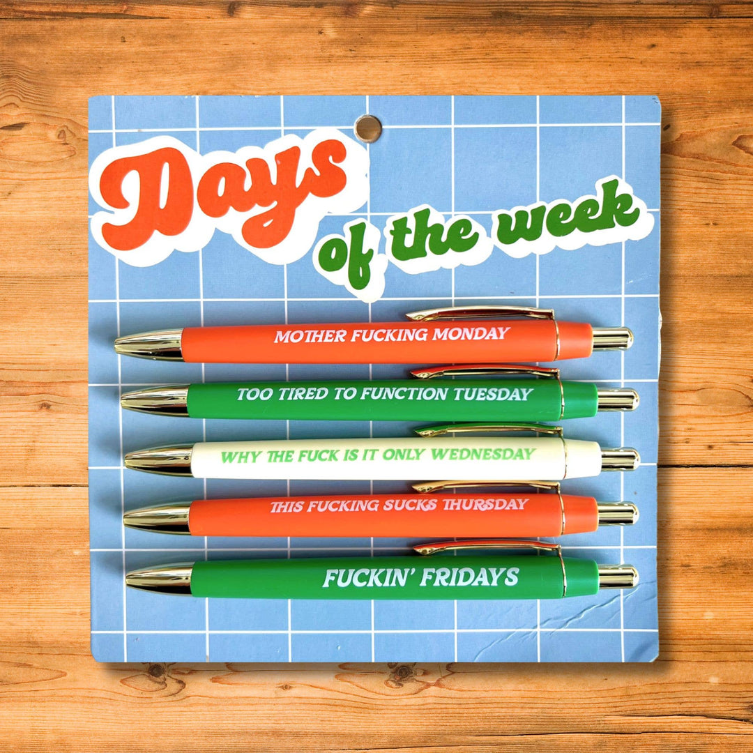 Set of pens with humorous phrases on a blue grid background