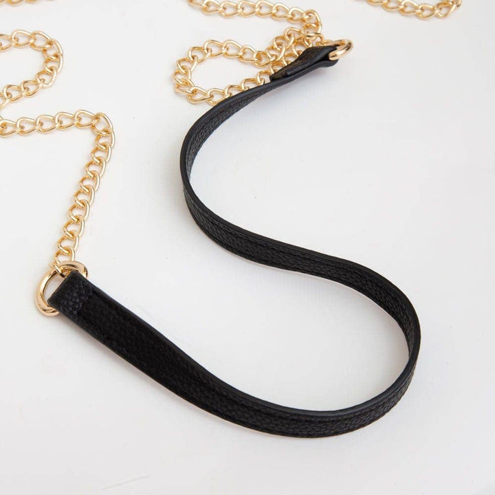 black clear crossbody bag with gold hardware and built-in sunglasses holder—stylish, functional, and stadium-ready.