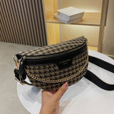 Handbag with houndstooth pattern and gold chain strap.