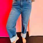 High-rise cuffed wide-leg denim pants with wide cuffs, 11-inch rise, and flattering relaxed silhouette.