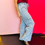 Side profile of the Jovie Tie Waist Jeans showing the adjustable tie waist, side stitching details, and flattering semi high-rise cut.