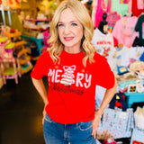 Red tee with pink Christmas cake tree, bow topper, golden snowflakes, and “Merry Christmas” text.