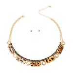 A matte gold layered necklace set featuring leopard print links and black accents.