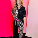 Leopard and black pajama set with pink piping, ruffled pants, and bright pink waist tie.