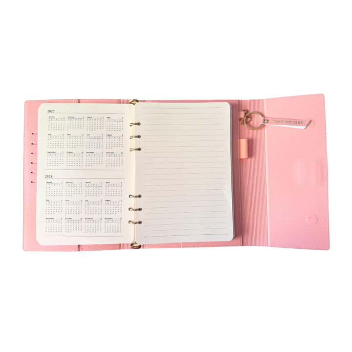 Calendar view of pink magnetic closure journal folio and calendar with gold graphics.