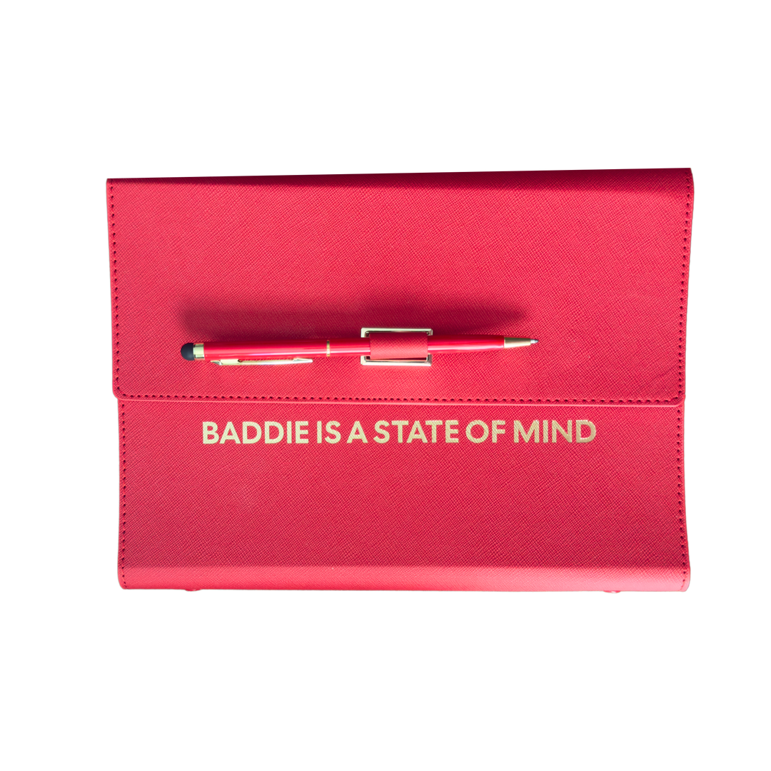 Red clutch organizer with a pen and 'Baddie is a State of Mind' text.