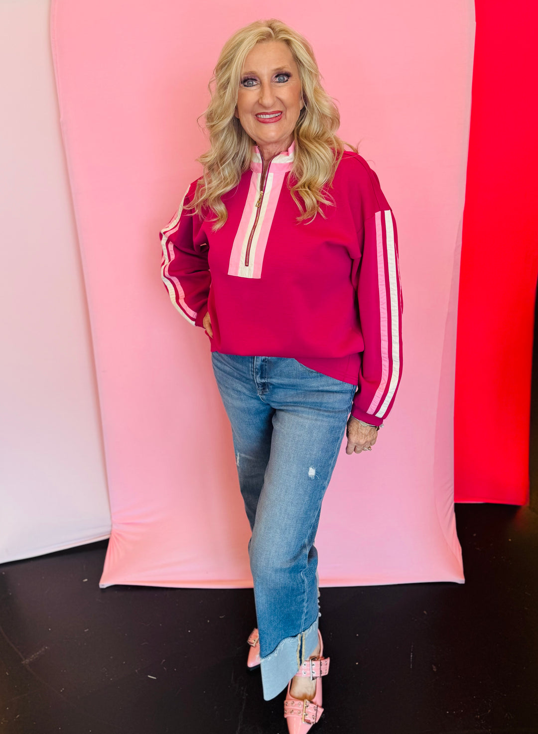 Magenta sweatshirt with pink and white ribbon trim and half zip closure