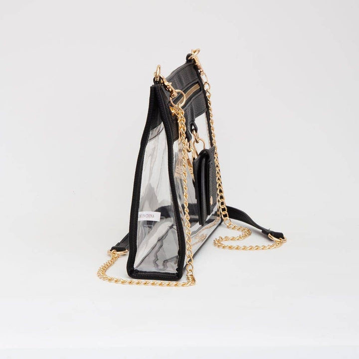 Clear crossbody bag with black trim, gold hardware, and a detachable sunglasses holder—fun, functional, and stadium-approved.