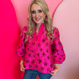 Hot pink floral jacquard puff sleeve top with split neckline and cuffed 3/4 sleeves.