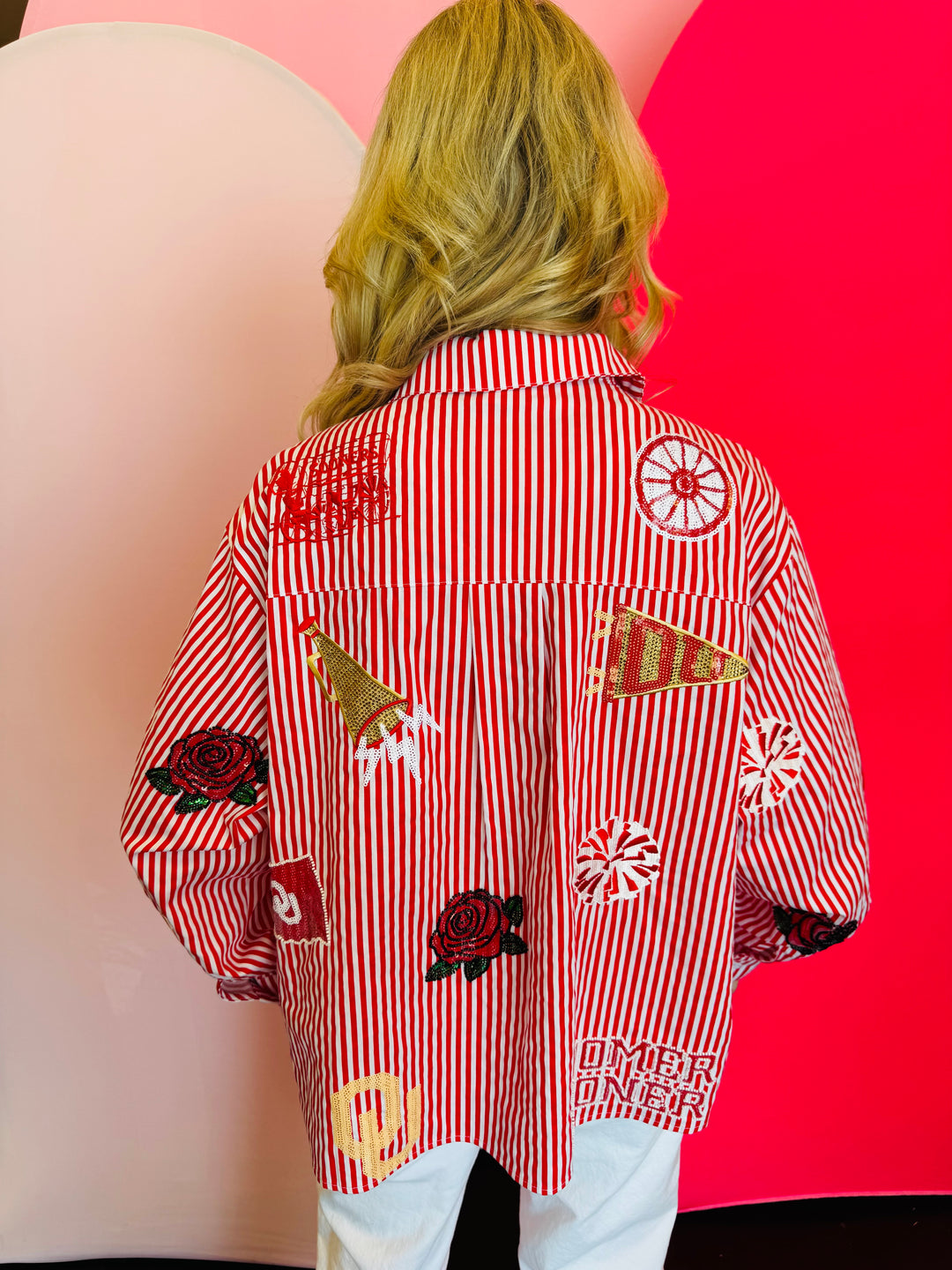 Back side of Queen Of Sparkles crimson red and white stripe icon University Of Oklahoma game day blouse.