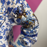 Queen Of Sparkles Blue & White Floral Vintage Santa Sweatshirt