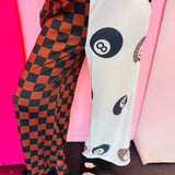 Split pants with black and leopard eight balls and checkered leg