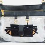 Clear crossbody bag with black trim, gold hardware, and a detachable sunglasses holder—fun, functional, and stadium-approved.