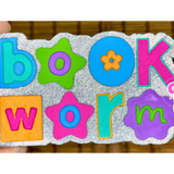 90s Bookworm freshie with colorful retro lettering and flower details.