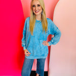 Deep sky blue acid wash fleece sweatshirt with front kangaroo and side pockets.