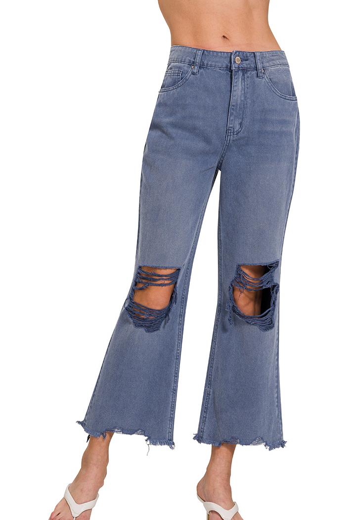 Blackberry colored washed cropped jeans with distressed knees and raw hem