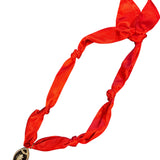 Red satin scarf necklace with a black rhinestone encrusted football charm.