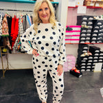 White polka dot long sleeve top and jogger pants lounge set with elastic waistband.