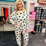 White polka dot long sleeve top and jogger pants lounge set with elastic waistband.