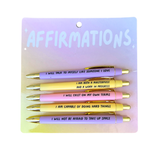 Set of five Affirmations pens with motivational quotes in black ink on pastel-colored barrels.