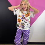 White Halloween tee with colorful pumpkins, black cat, witch hat, bats, candy, and sequins.