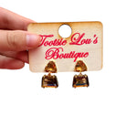 Amber geometric drop earrings with honey-brown triangle gemstones and sparkling rectangular crystal drops.